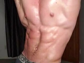 College boy shows off his oiled up bodybuilder skills