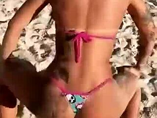 Black stud Mc Mirela shows off in a bikini on the beach