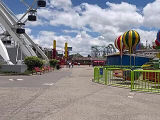 Real amateur lesbians engage in public fingering in amusement park